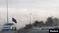 Smoke rises during heavy clashes between rival factions in Tripoli, Libya, May 27, 2017.