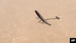 In this photo released by Solar Impulse, "Solar Impulse 2", a solar-powered airplane flies after taking off from Al Bateen Executive Airport in Abu Dhabi, United Arab Emirates, March 9, 2015.