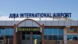 FILE - A man walks in front of the departure gate at Juba International Airport in Juba, South Sudan, Oct. 29, 2018. 