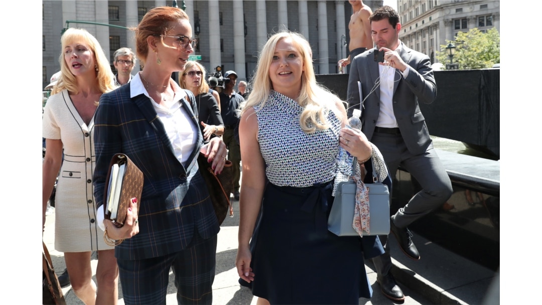 Virginia Giuffre, an alleged victim of Jeffrey Epstein, leaves after the hearing in the criminal case against Epstein, at Federal Court in New York, Aug. 27, 2019.