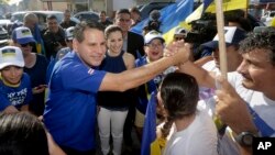 National Restoration Party presidential candidate Fabricio Alvarado greets supporters during a rally in San Jose, Costa Rica, March 31, 2018. 