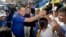 National Restoration Party presidential candidate Fabricio Alvarado greets supporters during a rally in San Jose, Costa Rica, March 31, 2018. 