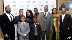 FILE - The cast of "Moonlight," winners of the Jury Award for Ensemble Performance, pose for a photo at the IFP Gotham Independent Film Awards at Cipriani Wall Street in New York, Nov. 28, 2016. 