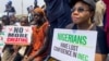 Supporters of the Peoples Democratic Party protest at the national headquarters of the Independent National Electoral Commission to question the outcome of the February 25 election result in Abuja, Nigeria, March 6, 2023. 