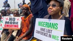 FILE - Supporters of the People's Democratic Party protest election results at the national headquarters of the Independent National Electoral Commission in Abuja, Nigeria, on March 6, 2023.