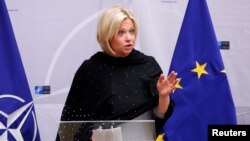 FILE - Then-Dutch Defense Minister Jeanine Hennis-Plasschaert delivers a speech in Brussels, Belgium, Feb. 16, 2017.