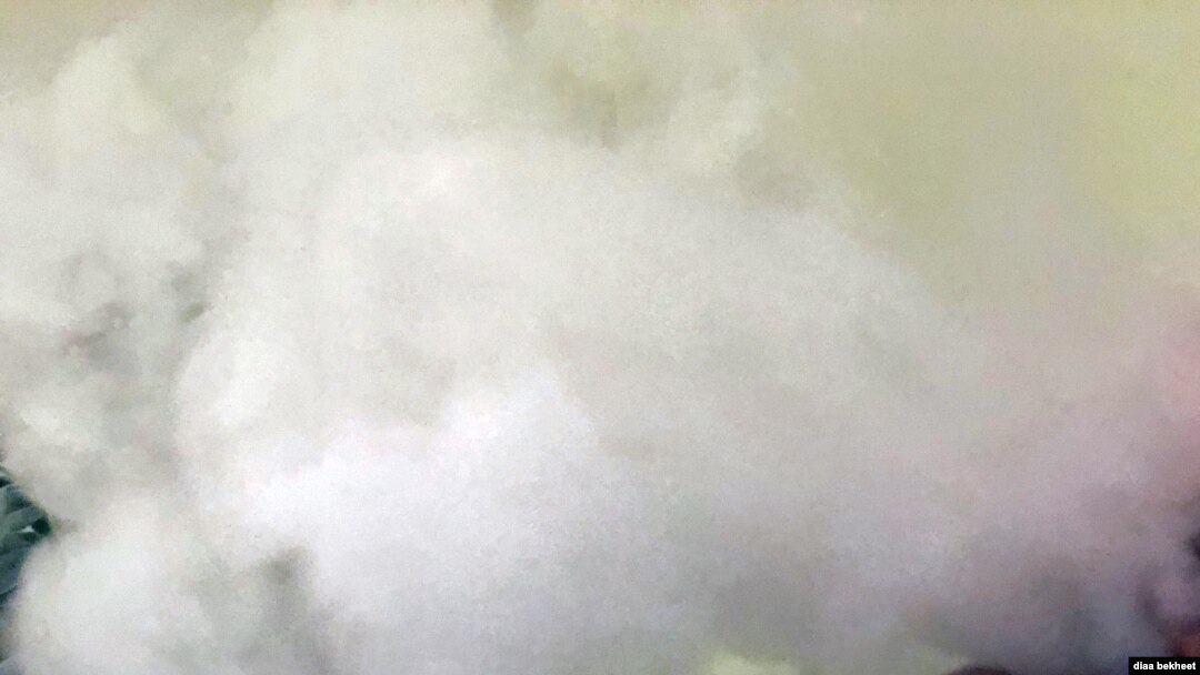 FILE- A man vapes with an electronic cigarette, exhales in Fair Oaks, Virginia. (Phot: Diaa Bekheet). The Centers for Disease Control and Prevention said on Oct. 24, 2019, that 125 additional cases of vaping related illnesses have been reported last week.