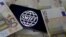 Swift code bank logo is displayed on an iPhone 6s on top of Euro banknotes in this picture illustration made in Zenica, Bosnia and Herzegovina on January 26, 2016.