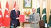 Turkish President Recep Tayyip Erdogan, left, and Pakistani Prime Minister Shahbaz Sharif hold copies of a joint declaration at the Pakistan-Turkey High Level Strategic Cooperation Council in Islamabad on Feb. 13, 2025. (Ministry of Information and Broadcasting, Pakistan)