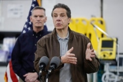 New York Gov. Andrew Cuomo speaks during a news conference alongside the National Guard in New York, March 23, 2020.