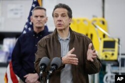 New York Gov. Andrew Cuomo speaks during a news conference alongside the National Guard in New York, March 23, 2020.