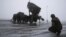 German troops beside a Patriot missile battery during a media rehearsal, Warbelow, Dec. 18, 2012.