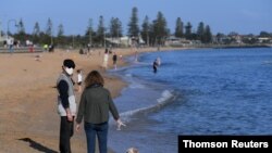 People enjoy the sunshine at Elwood beach in Melbourne, Australia, Sept. 14, 2020.