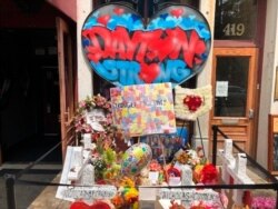 A makeshift memorial sits outside Ned Peppers nightclub in the Oregon District entertainment neighborhood where on Aug. 4 a gunman killed nine people, on Aug. 14, 2019, in Dayton Ohio.