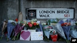 Tributes are seen at the southern end of London Bridge in London, Dec. 2, 2019, after a man previously convicted of terrorism offenses stabbed two people to death and injured three others before being shot dead by police. 