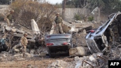 Lebanese army soldiers inspect the damage in the southern Lebanese village of Al-Khiam, near the border with Israel, on Dec. 12, 2024.