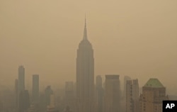 FILE - Smog from wildfires in Canada shrouds the Empire State Building in New York on Sept. 6 2023.