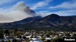 A wildfire known as the Thomas Fire continues to burn in the hills outside Fillmore, California, Dec. 8, 2017. 