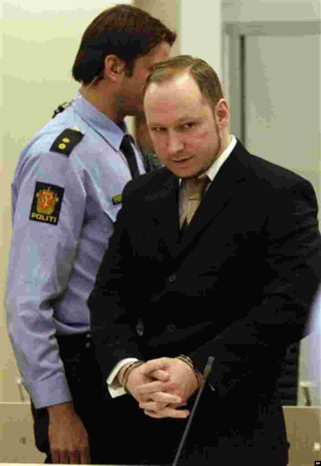 Accused Norwegian Anders Behring Breivik arrives at the courtroom, in Oslo, Norway, Tuesday April 17, 2012. The anti-Muslim fanatic who admitted to killing 77 people in a bomb-and-shooting massacre is set to take the stand in his terror trial. Anders Behr