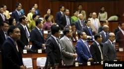 File Photo: Members of parliament attend a plenary session at the Cambodia National Assembly in Central Phnom Penh December 16, 2015. REUTERS/Channa - RTX1YVKB