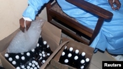 Boxes with concoctions made by Samuel Kleda, Archbishop of Douala, who claims that they have helped treat COVID-19 patients and distributes for free, are seen in the office of Saint Paul Catholic Hospital deputy director in Douala, Cameroon, June 9, 2020.
