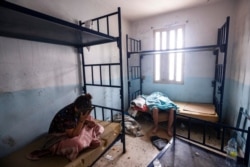 Minors who crossed into Spain take shelter inside an abandoned building in Ceuta, May 21, 2021.