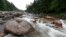 FILE - The Wassataquoik Stream flows through Township 3, Range 8, Maine, on land owned by environmentalist Roxanne Quimby, the founder of Burts Bees, Aug. 4, 2015.