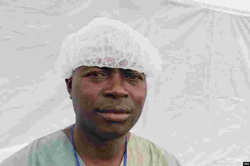 Bangalie V. Kamara works as an assistant physician at Doctors Without Borders Elwa 3 Ebola management center and says Ebola has caused a big problem in his 15-year marriage, Monrovia, Liberia, Oct. 9, 2014. (Benno Muchler/VOA