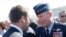 FILE - In this June 19, 2017 file photo, French President Emmanuel Macron, meets with Gen. Tod Wolters, while visiting the Paris Air Show in Le Bourget, north of Paris.