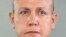 In this undated photo released by the Broward County Sheriff's office, Cesar Sayoc is seen in a booking photo, in Miami.
