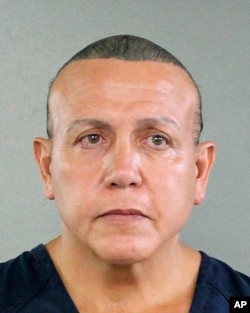 In this undated photo released by the Broward County Sheriff's office, Cesar Sayoc is seen in a booking photo, in Miami.