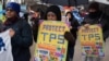 FILE - Demonstrators participate in the March For TPS Justice as they rally outside the White House in Washington, D.C., February 12, 2019. 