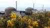 FILE - Three reactors make up the Flamanville 3 nuclear power plant in Flamanville, France, on April 25, 2024, with the European Pressurized Reactor at far right. France connected the EPR to the power grid for the first time on Dec. 21, 2024.