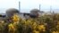 FILE - Three reactors make up the Flamanville 3 nuclear power plant in Flamanville, France, on April 25, 2024, with the European Pressurized Reactor at far right. France connected the EPR to the power grid for the first time on Dec. 21, 2024.