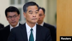 FILE - Hong Kong Chief Executive Leung Chun-ying arrives at a news conference which was held as part of the National People's Congress, the country's parliament, in Beijing, March 6, 2015.