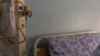 FILE - A TB patient sleeps in his room at the Sizwe Tropical Diseases Hospital in Johannesburg, South Africa, August 5, 2019. 