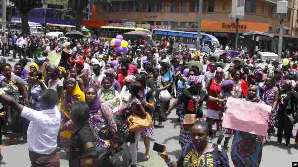 Women from Kenya, Uganda, Tanzania, Rwanda and Burundi participate in the world march of woman in Nairobi, Kenya