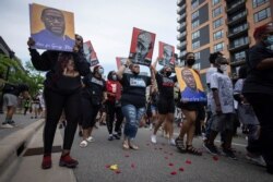Family members of Daunte Wright march for the one-year anniversary of George Floyd's death, in Minneapolis, Minnesota, May 23, 2021.