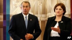 Speaker of the United States House of Representatives John Boehner, R-Ohio, left, and Lithuania's Speaker of the Parliament Loreta Grauziniene speaks during a meeting at the Parliament's palace in Vilnius, Lithuania, June 29, 2015. 