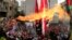 Protesters set a U.S flag on fire near the U.S. Embassy in Awkar north of Beirut, Lebanon, Dec. 10,2017. 