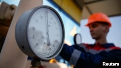 FILE - A pressure gauge is seen at a gas compressor station near Uzhhorod, western Ukraine, May 21, 2014.