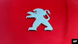 A Peugeot logo pictured on a car in Bayonne, southwestern France, Oct.31, 2019.