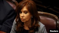 FILE - Former Argentine President and senator Cristina Fernandez de Kirchner attends a session at the Senate in Buenos Aires, Argentina, Aug. 22, 2018. 