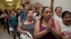 People shout out against the Strengthen and Fortify Enforcement Act in the hall outside the House Judiciary Committee hearing on Capitol Hill in Washington, June 18, 2013. 