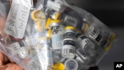 FILE - Vials of the Jynneos vaccine for mpox are seen from a cooler at a vaccinations site on Aug. 29, 2022, in New York. South African health authorities reported on June 13, 2024, that two men died from mpox in the space of three days.