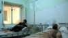 Injured workers of HALO Trust de-mining organization are treated at a hospital in northern Baghlan province, Afghanistan, June 9, 2021.