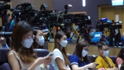 Journalists wearing face masks to help curb the spread of the coronavirus attend a press conference by Hong Kong Chief Executive Carrie in Hong Kong, Aug. 17, 2021.