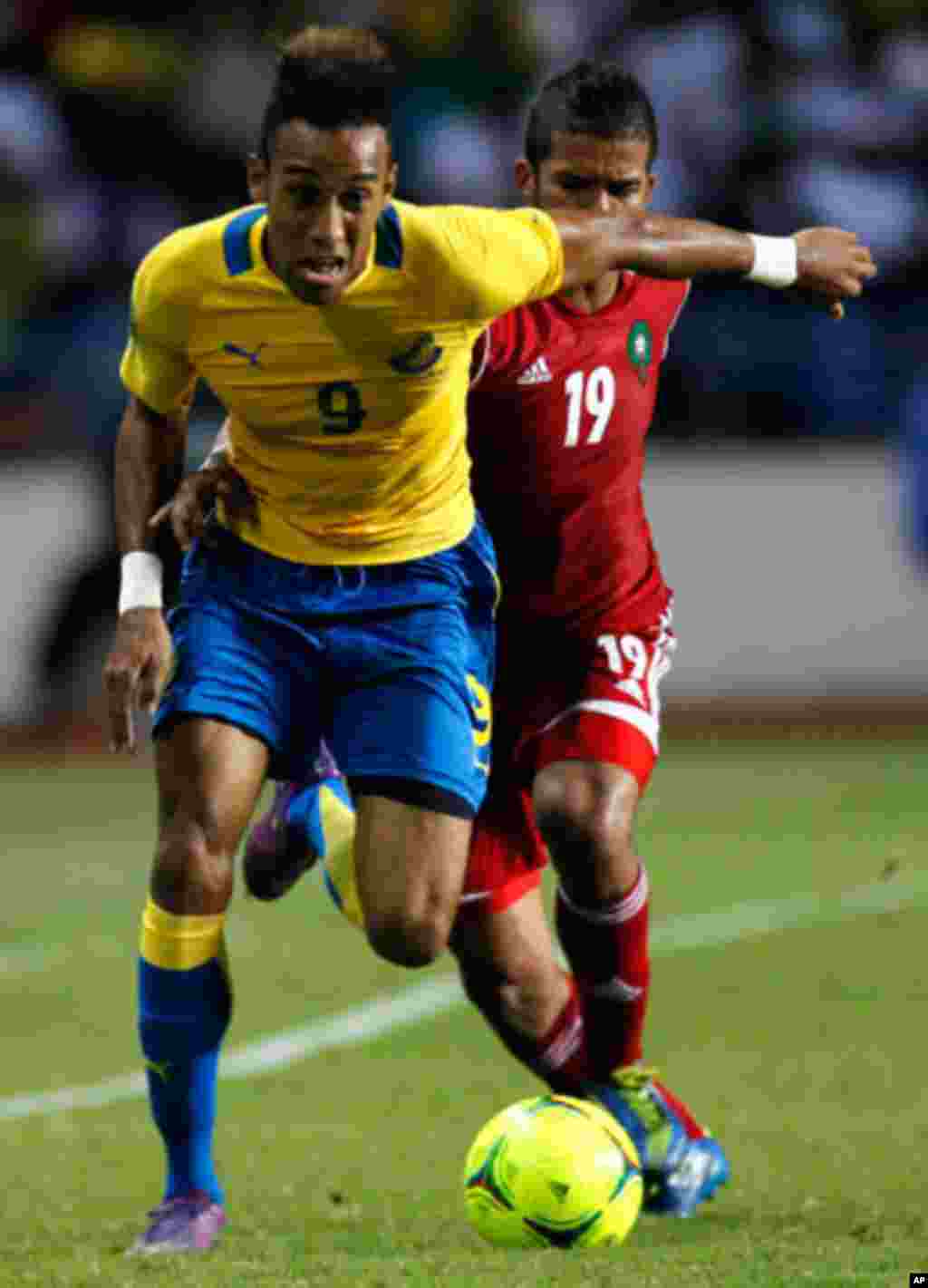 Gabon's Emerick drives the ball past Morocco's Mehdi during their African Cup of Nations soccer in Libreville