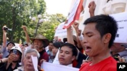 A Vietnamese protester reads out an anti-China declaration in front of the Opera House during a rally in downtown Hanoi on July 3, 2011 amid an ongoing territorial dispute in the South China Sea.