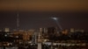 Ukrainian service personnel use a searchlight as they search for drones in the sky over the city during a Russian drone strike, amid Russia's attack on Ukraine, in Kyiv, Ukraine Oct. 25, 2024.